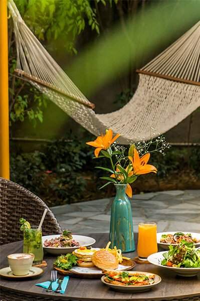 "A romantic table set for two at Karma Chalets, featuring a mouthwatering spread of dishes.