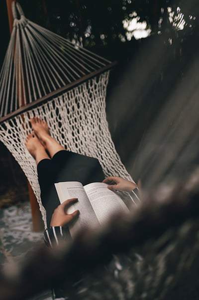 "Relaxing in a hammock at Karma Chalets engrossed in a captivating book